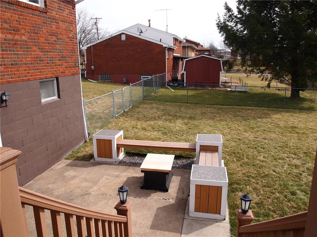 936 Lindsay Road Carnegie, PA 15106 - Photo 23 of 25 Additional entertaining space on lower level patio plus lots of play space in this level fenced back yard.