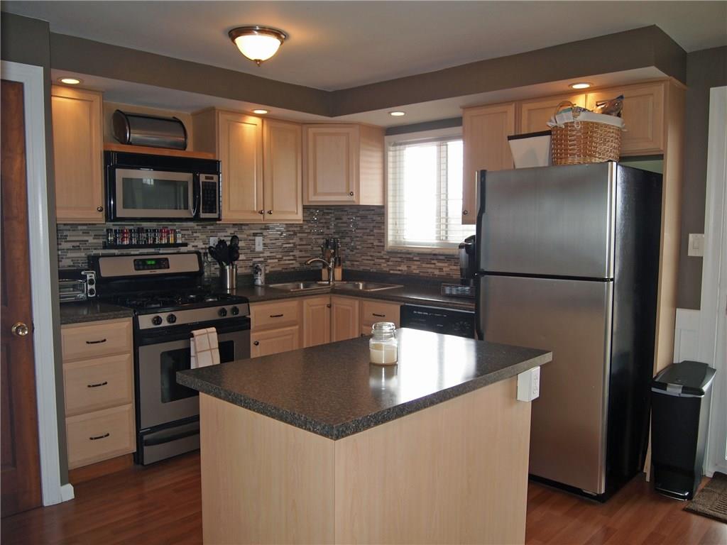 936 Lindsay Road Carnegie, PA 15106 - Photo 4 of 25 You'll love this updated kitchen - new counter tops, glass tile backsplash, new stainless steel appliances, new lighting.