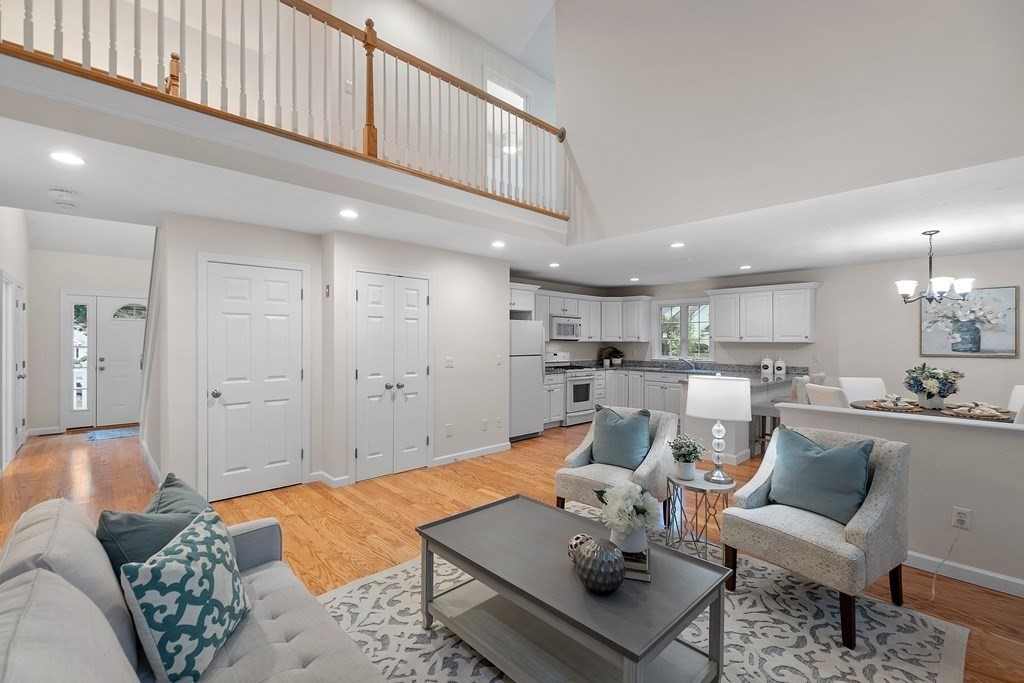 3 Reed Lane, Unit 3 Littleton, MA 01460 - Photo 5 of 29 a living room with furniture and kitchen view