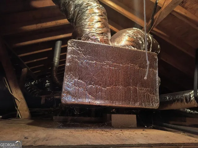 a view of storage and utility room with washer and dryer