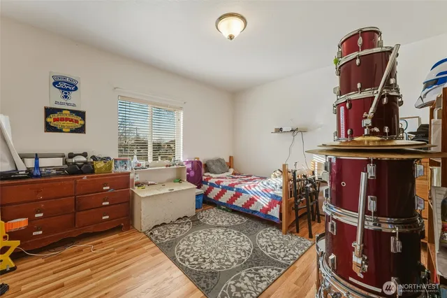 a bed room with a bed and a window