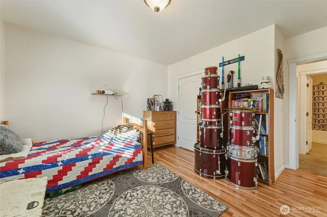a bedroom with bed and walk in closet