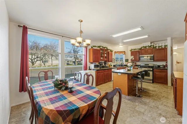 a very nice looking dining room with a table and chairs