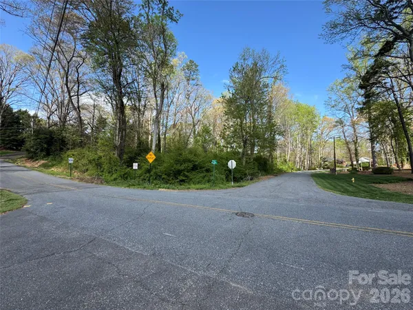 a view of road and trees
