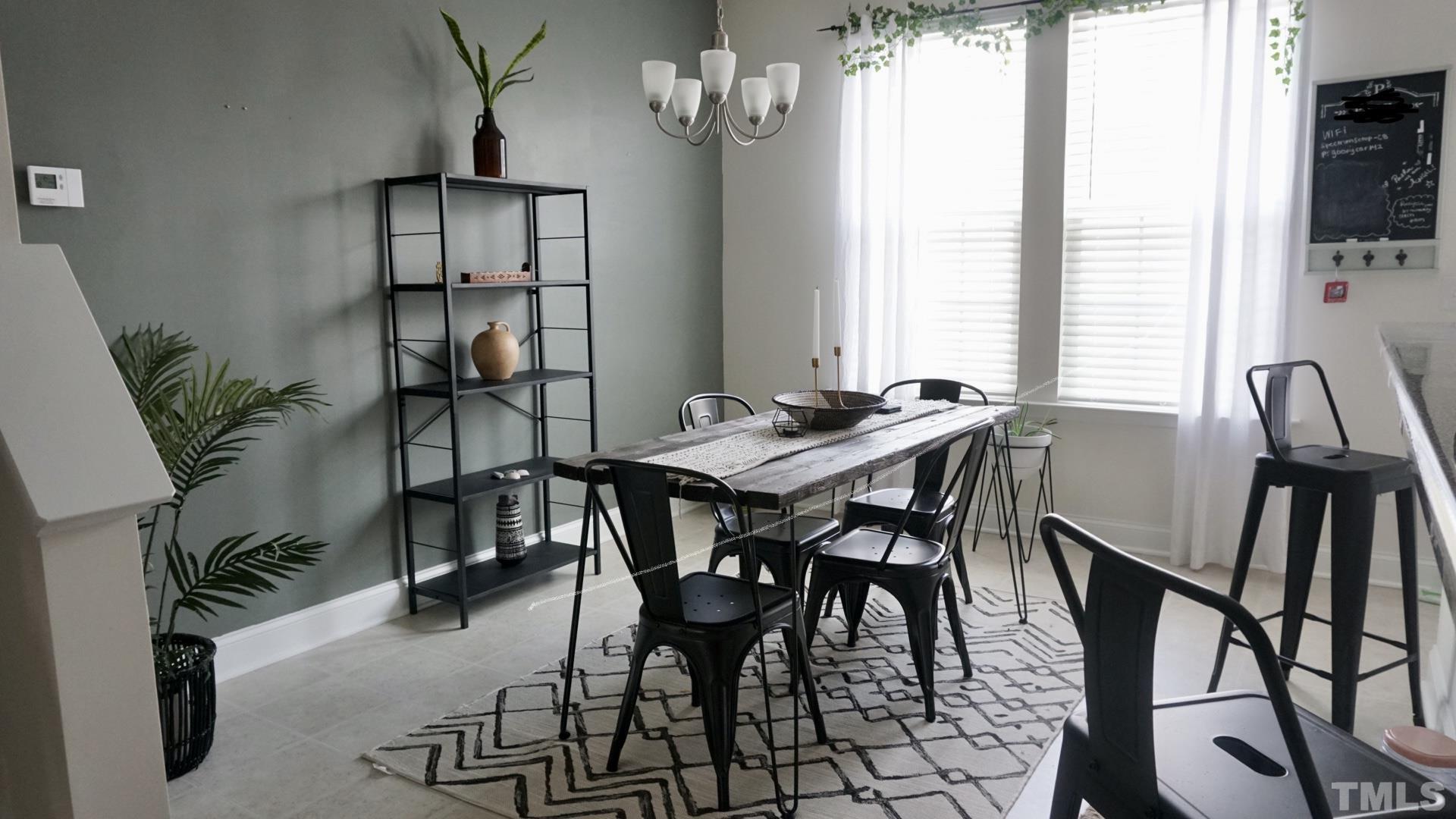 4413 Lord Joseph Court Raleigh, NC 27610 - Photo 3 of 4 a view of a dining room with furniture and window