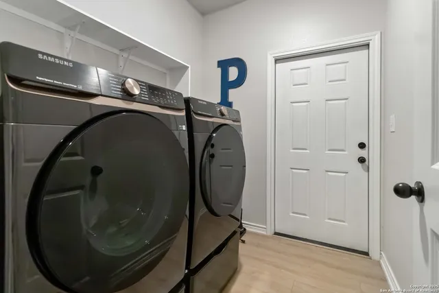 a utility room with mirror
