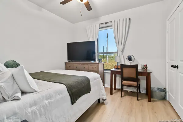 a bedroom with a bed and a table