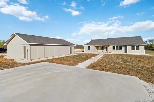 front view of a house with a dry yard