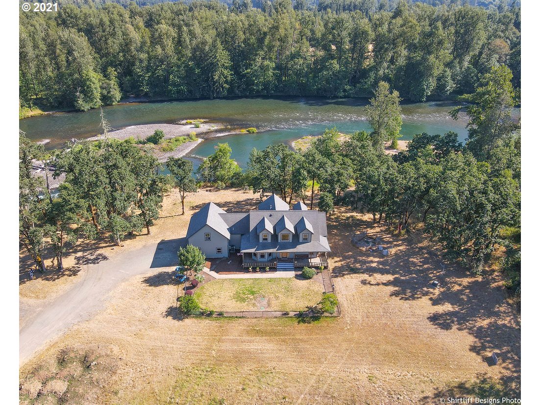 38636 Pengra Road Fall Creek, OR 97438 - Photo 1 of 32 a view of a lake with a yard