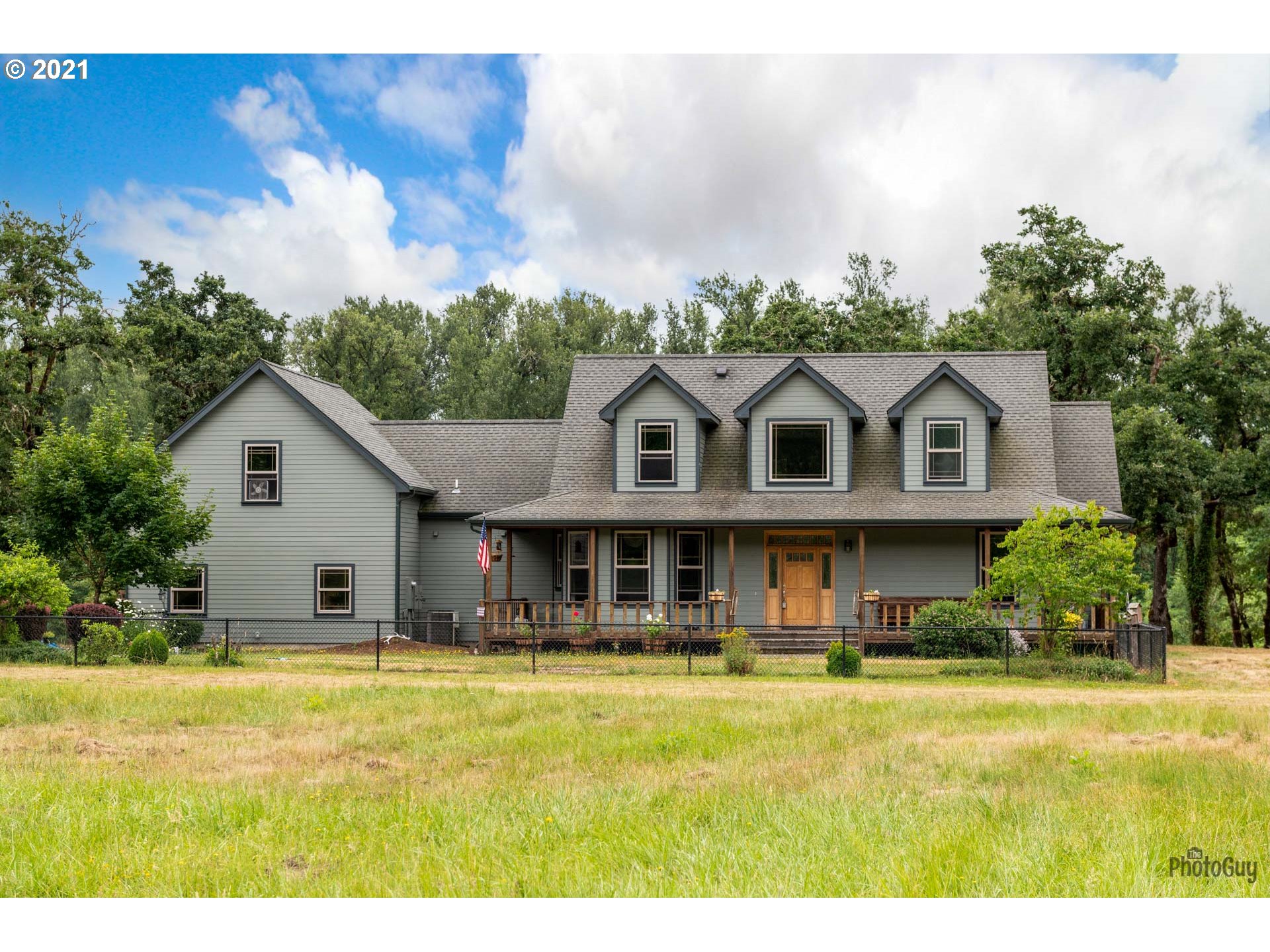 38636 Pengra Road Fall Creek, OR 97438 - Photo 3 of 32 a front view of house with yard swimming pool and green space