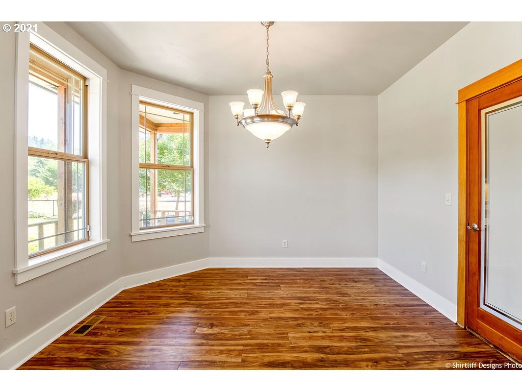 38636 Pengra Road Fall Creek, OR 97438 - Photo 6 of 32 a view of empty room with wooden floor and fan