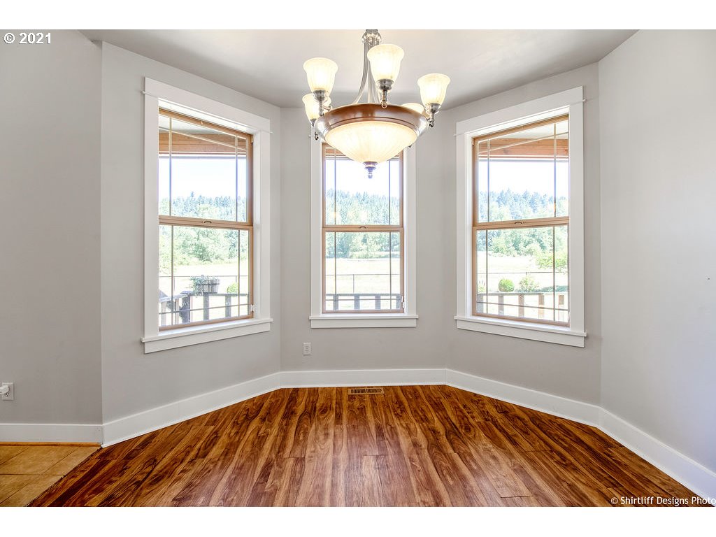 38636 Pengra Road Fall Creek, OR 97438 - Photo 7 of 32 a view of an empty room with wooden floor and a window