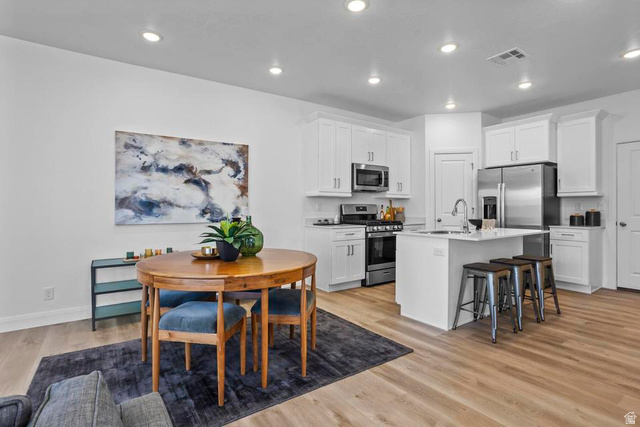 488 West Greenstone Pl Street, Unit 1010 St. George, UT 84790 - Photo 11 of 34 Open-concept living space with light wood-finish flooring