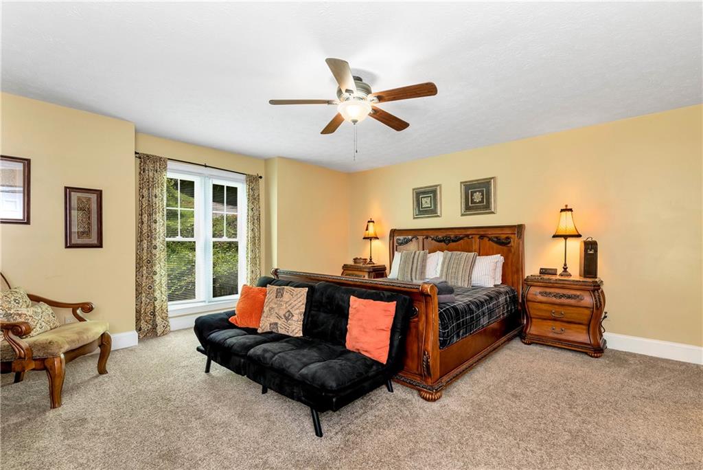 276 Zeppelin Strasse Helen, GA 30545 - Photo 22 of 60 a bedroom with a bed couch and window