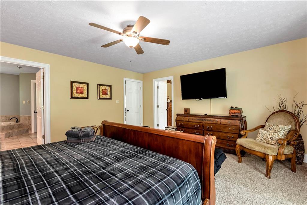 276 Zeppelin Strasse Helen, GA 30545 - Photo 23 of 60 a bedroom with a bed and a flat screen tv