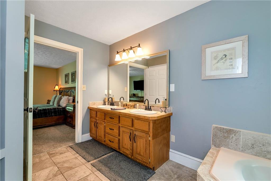 276 Zeppelin Strasse Helen, GA 30545 - Photo 25 of 60 a en suite bathroom with a toilet sink and mirror