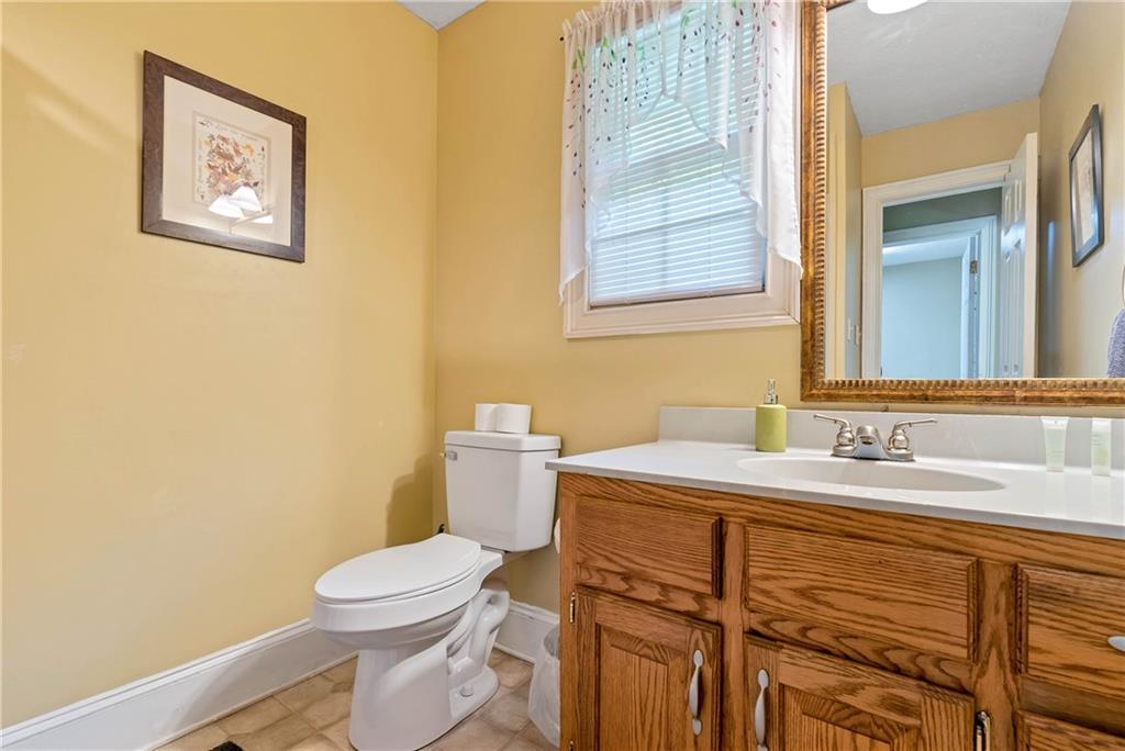 276 Zeppelin Strasse Helen, GA 30545 - Photo 26 of 60 a bathroom with a toilet sink and mirror