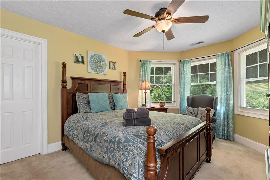 276 Zeppelin Strasse Helen, GA 30545 - Photo 33 of 60 a bedroom with a bed and wooden floor