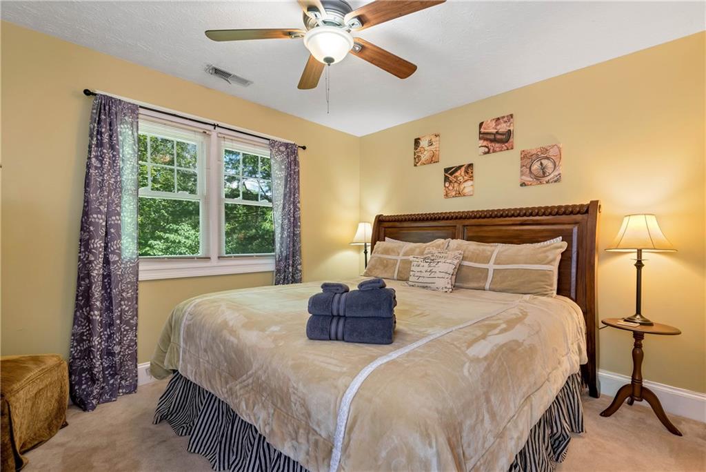 276 Zeppelin Strasse Helen, GA 30545 - Photo 35 of 60 a bedroom with a bed and window