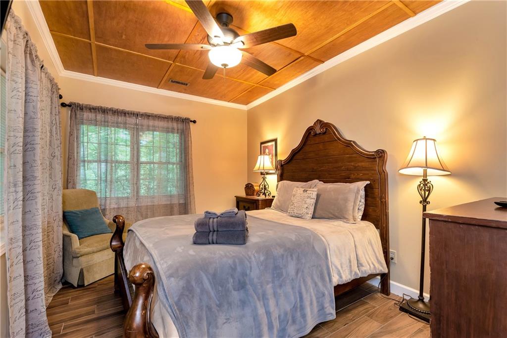 276 Zeppelin Strasse Helen, GA 30545 - Photo 42 of 60 a bedroom with a bed and wooden floor