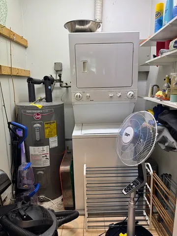 a view of storage and utility room with washer and dryer