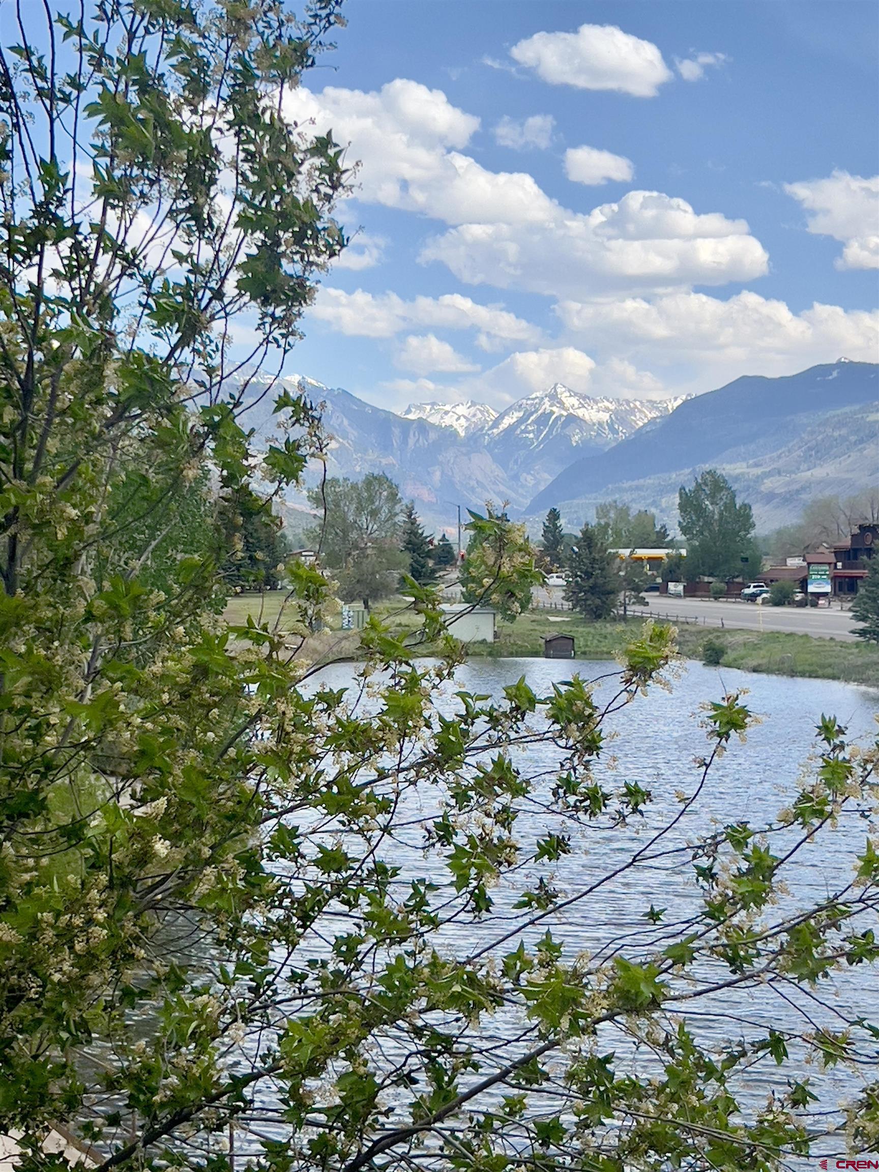 540 Redcliff Circle, Unit E 203 Ridgway, CO 81432 - Photo 32 of 36 a view of a lake with a city
