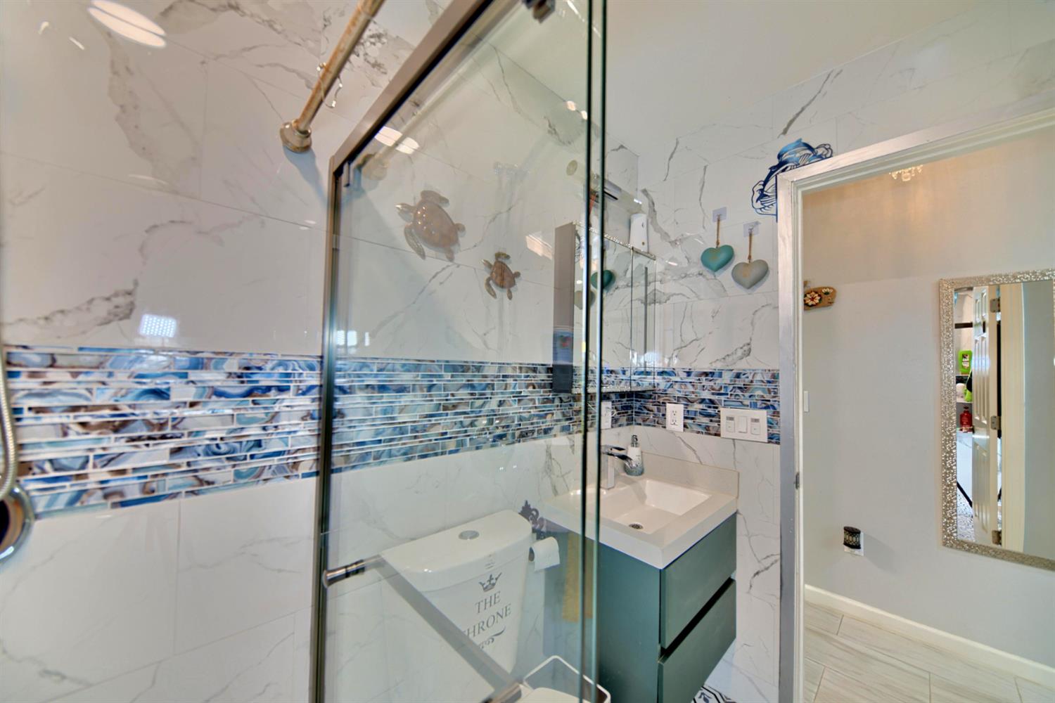 2013 Robertson Road Modesto, CA 95351 - Photo 21 of 24 a bathroom with a shower and a sink