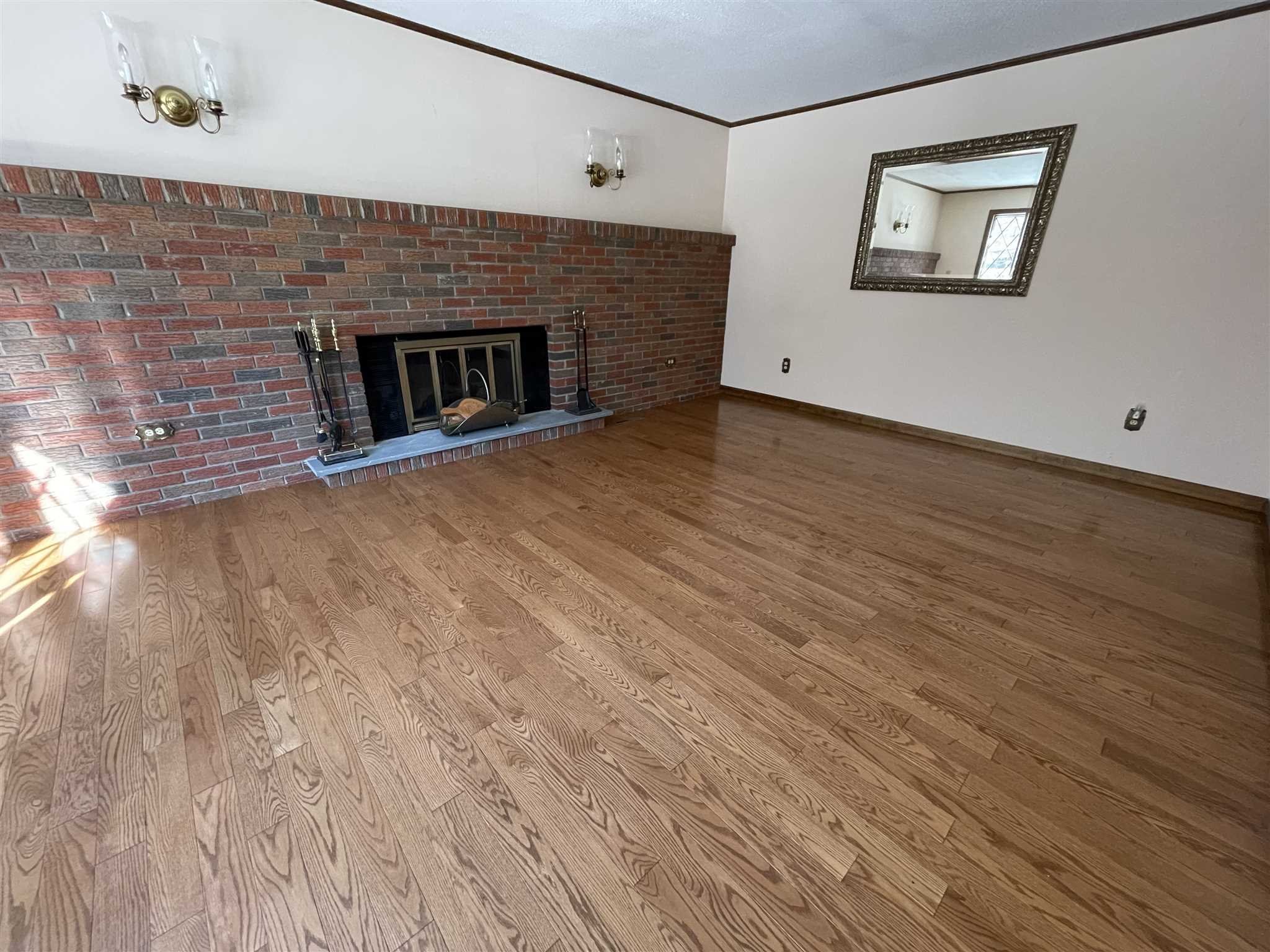 50 Allen Road Salt Point, NY 12578 - Photo 11 of 38 a view of an empty room with wooden floor and a fireplace