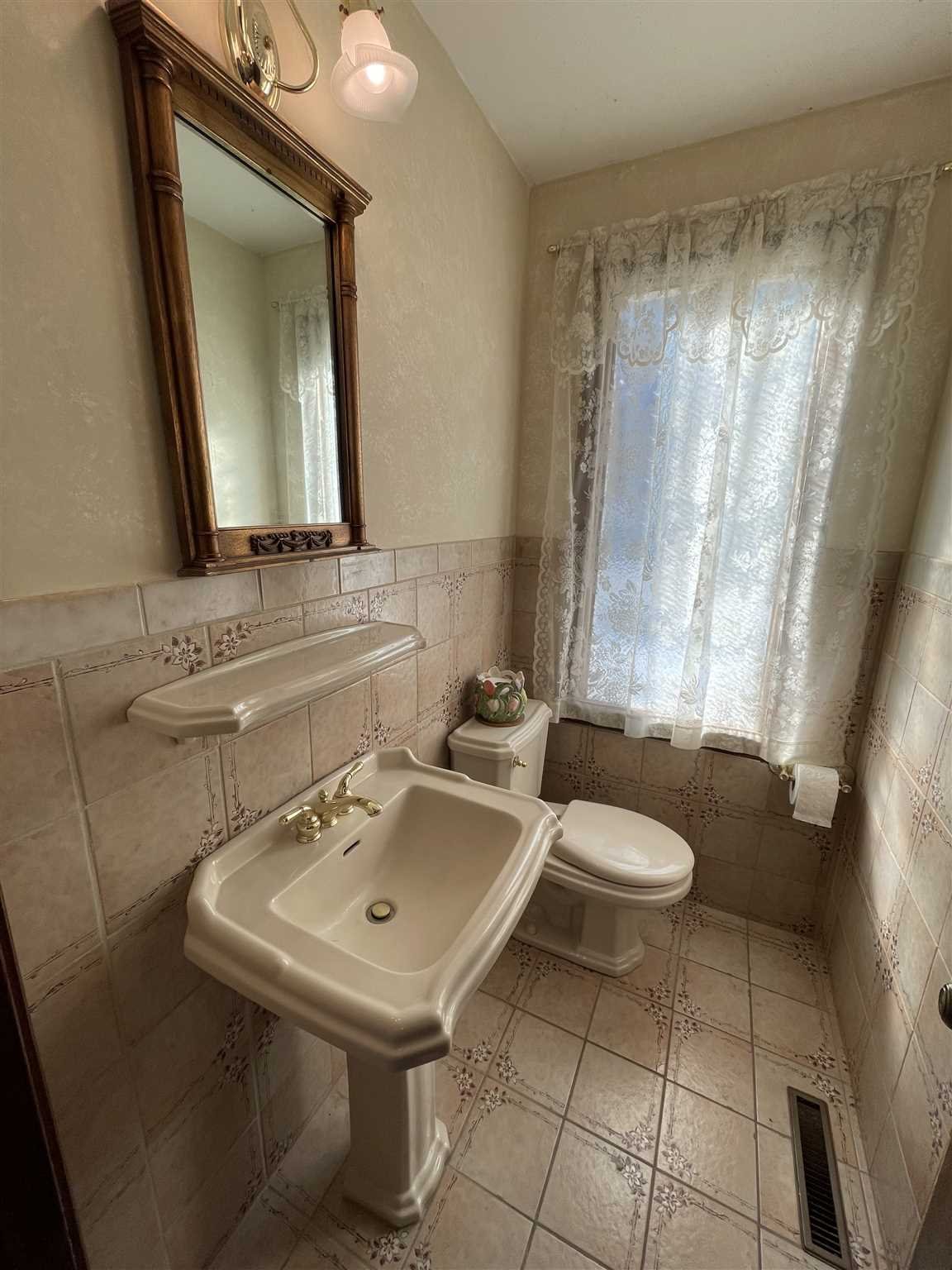50 Allen Road Salt Point, NY 12578 - Photo 13 of 38 a bathroom with a sink a toilet and mirror