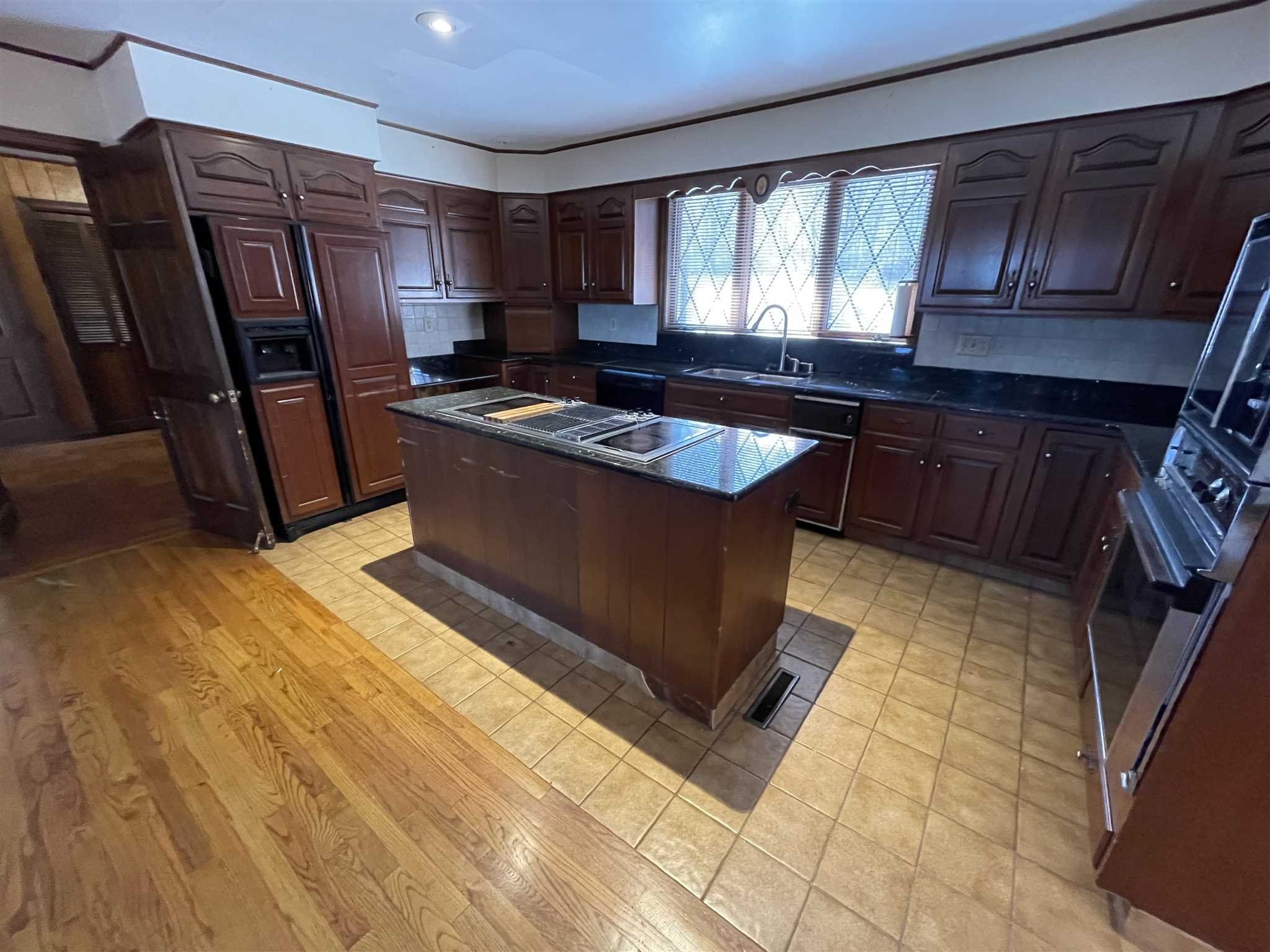 50 Allen Road Salt Point, NY 12578 - Photo 14 of 38 a kitchen with stainless steel appliances granite countertop a stove a sink and a refrigerator