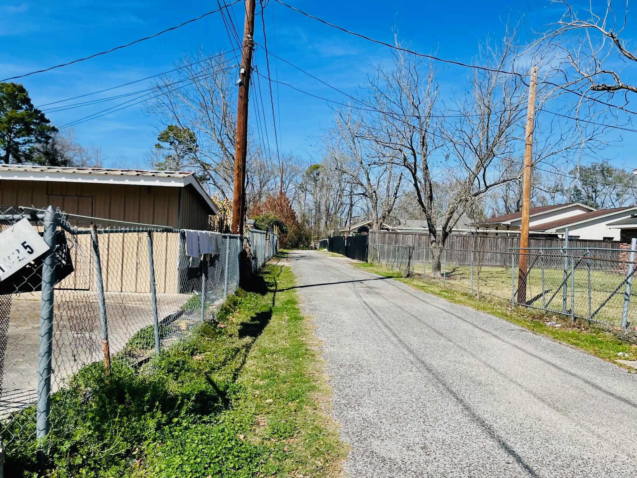 1825 Isom Street Houston, TX 77039 - Photo 3 of 27 a view of a pathway of a house with a yard