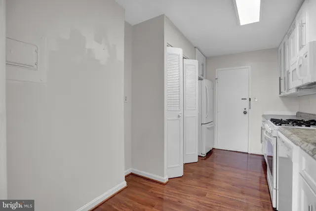a view of a kitchen with wooden floor