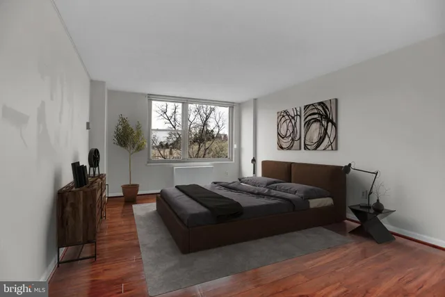 a bed room with a bed and a window