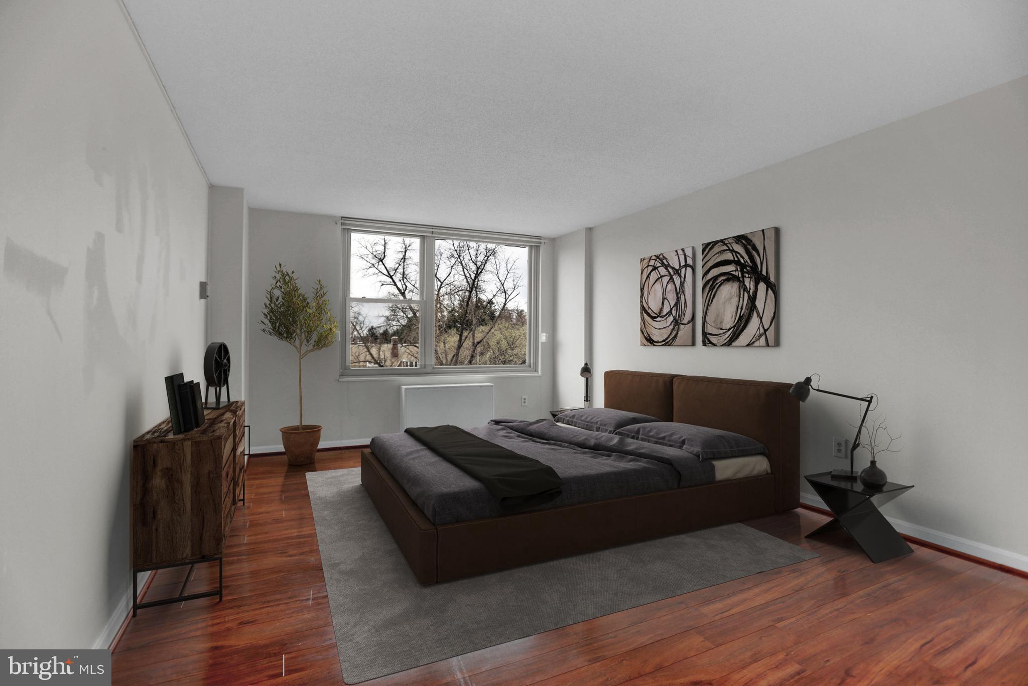 4401 Roland Avenue, Unit 304 Baltimore, MD 21210 - Photo 14 of 50 a bed room with a bed and a window