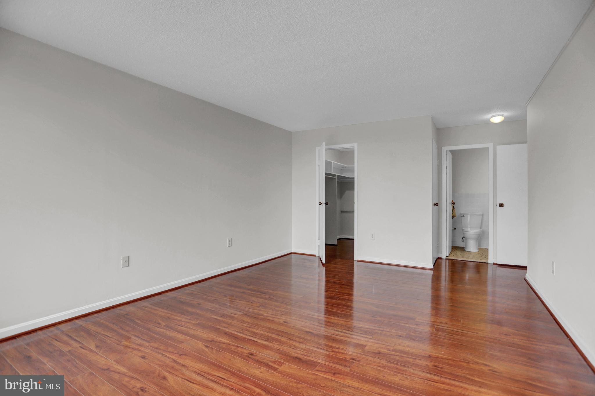 4401 Roland Avenue, Unit 304 Baltimore, MD 21210 - Photo 16 of 50 a view of an empty room with wooden floor