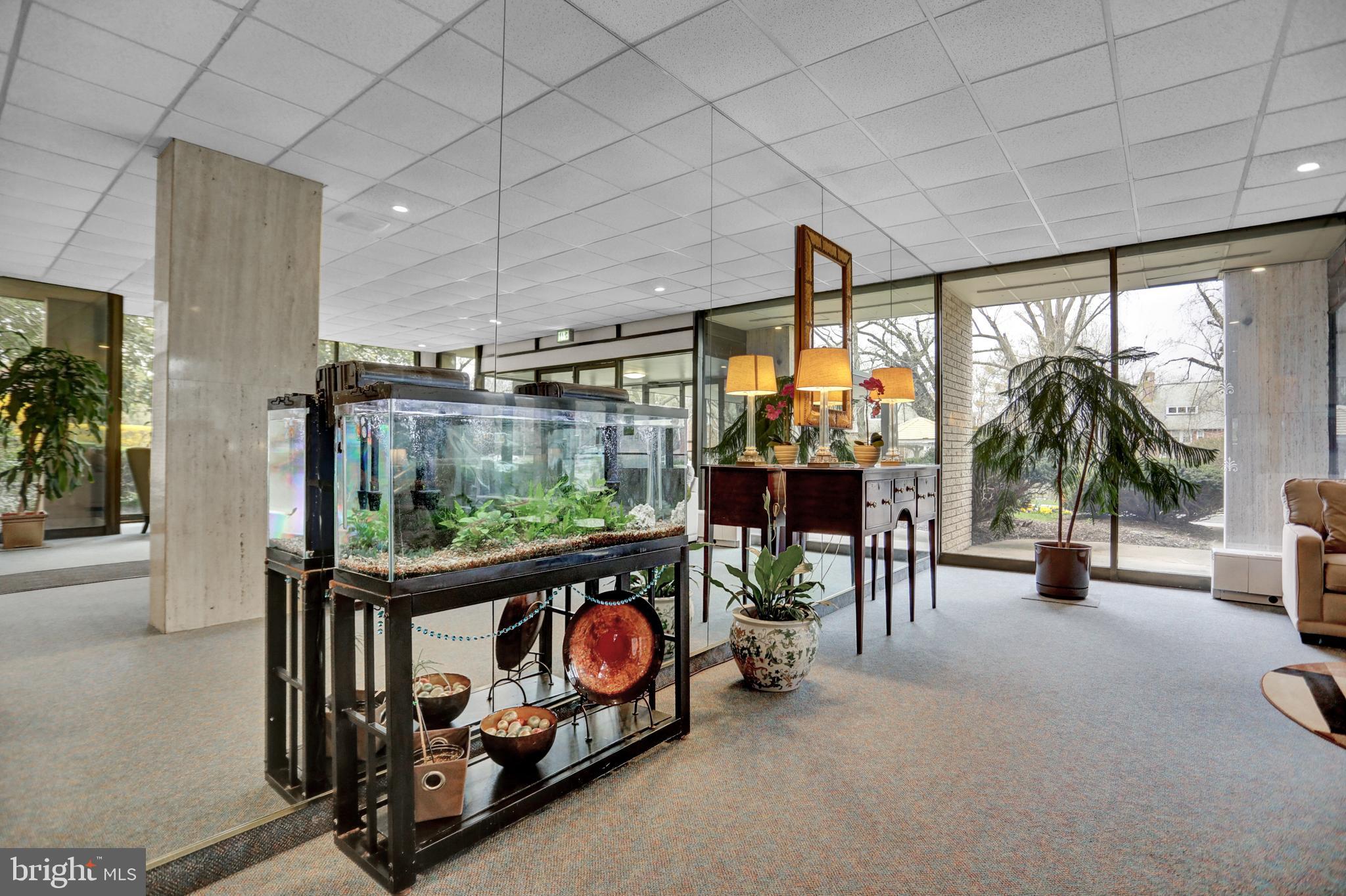 4401 Roland Avenue, Unit 304 Baltimore, MD 21210 - Photo 29 of 50 a view of a porch with furniture and garden