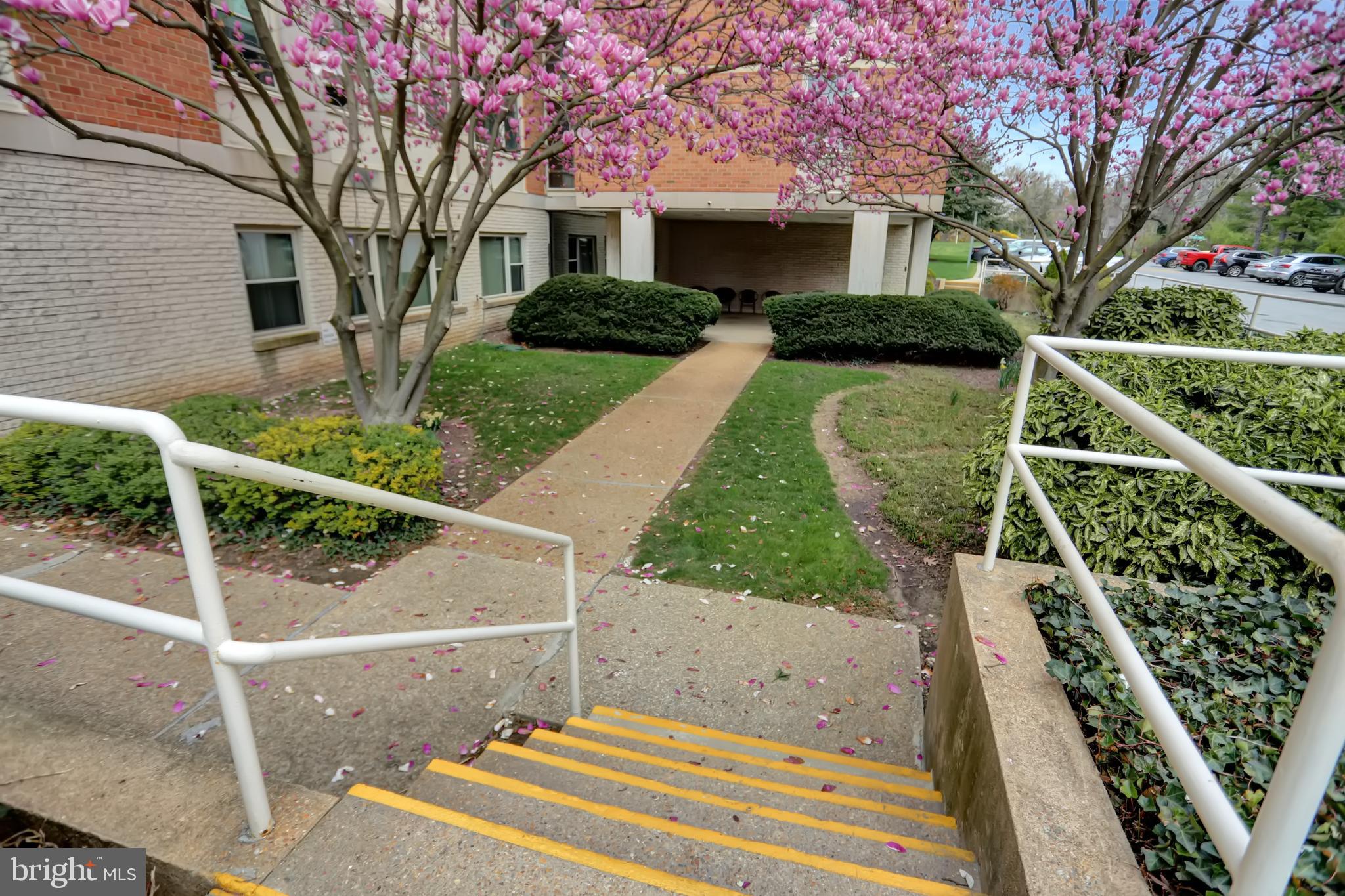 4401 Roland Avenue, Unit 304 Baltimore, MD 21210 - Photo 40 of 50 a front view of a house with garden