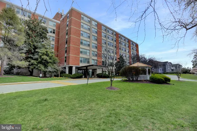 a view of a building with a yard