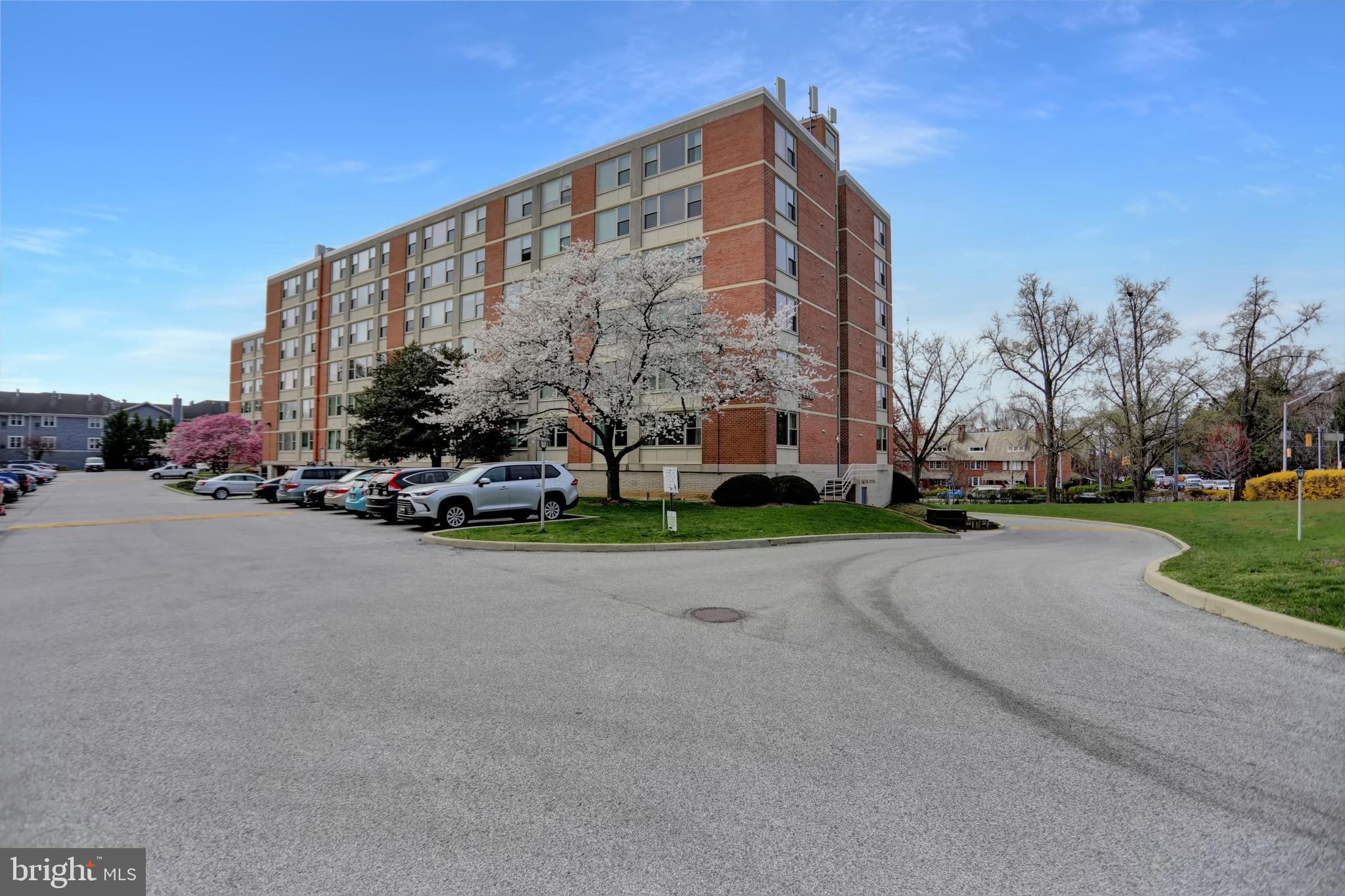 4401 Roland Avenue, Unit 304 Baltimore, MD 21210 - Photo 46 of 50 a tall buildings with trees in the background