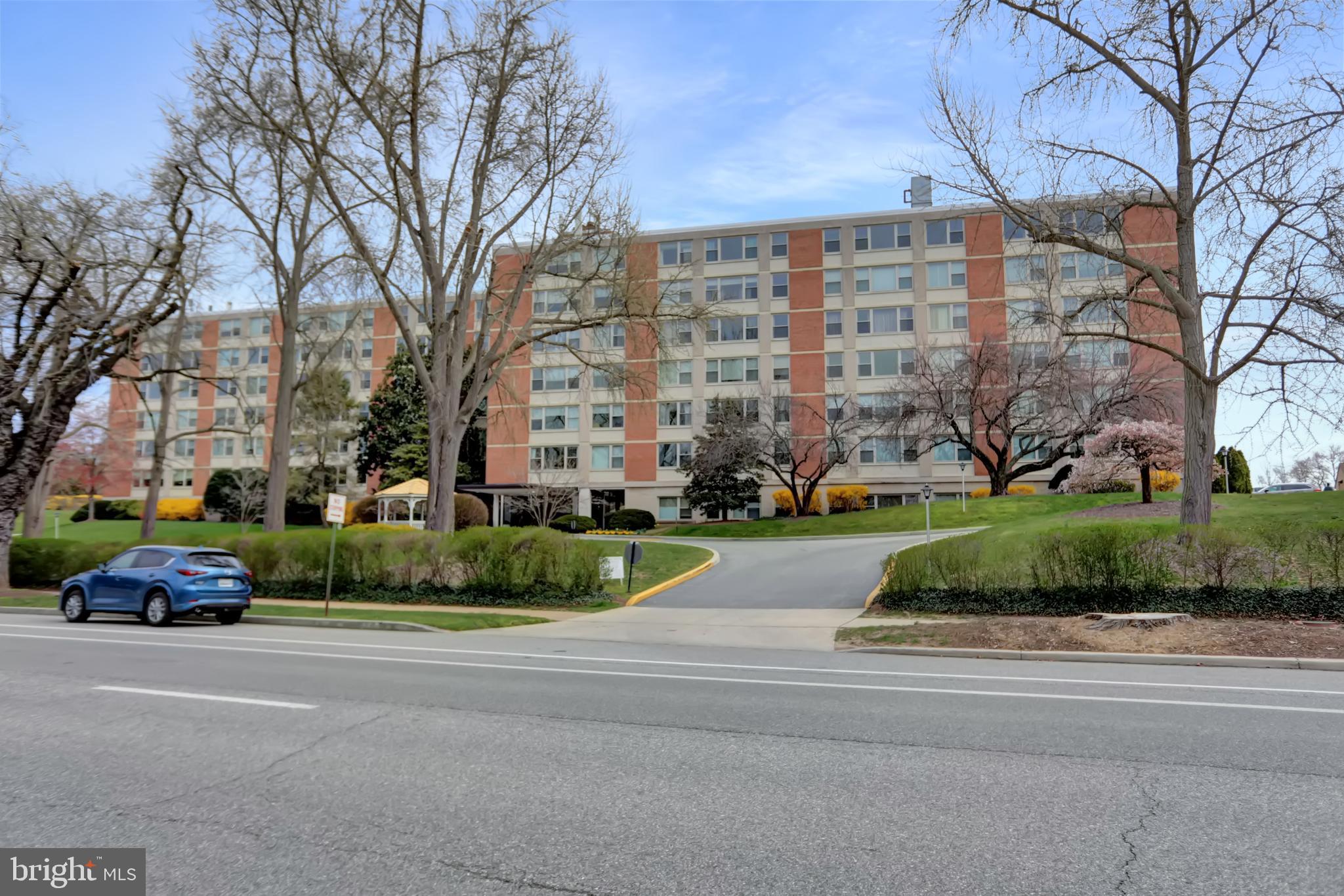 4401 Roland Avenue, Unit 304 Baltimore, MD 21210 - Photo 47 of 50 a cars parked on the side of a street