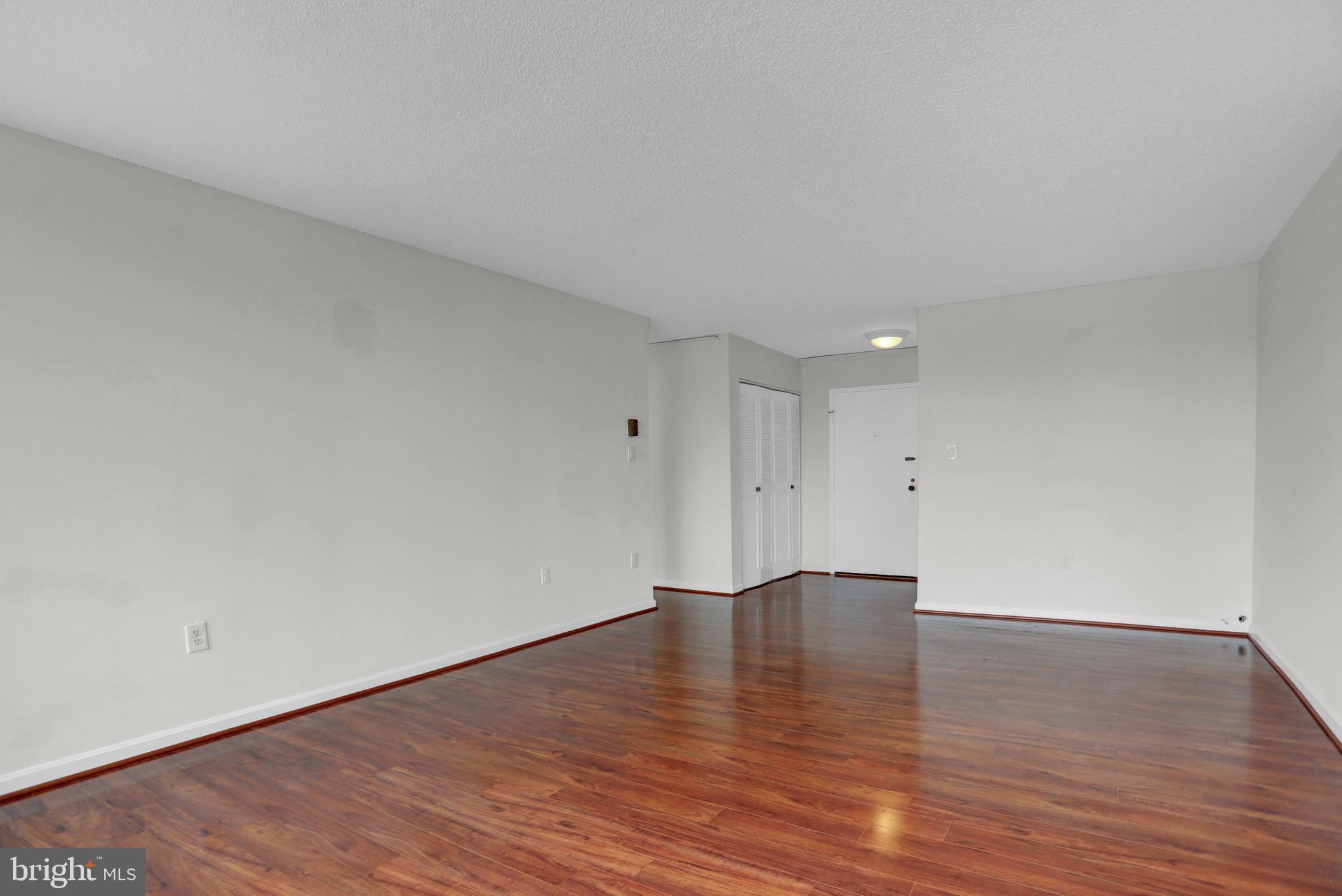 4401 Roland Avenue, Unit 304 Baltimore, MD 21210 - Photo 8 of 50 a view of an empty room with wooden floor