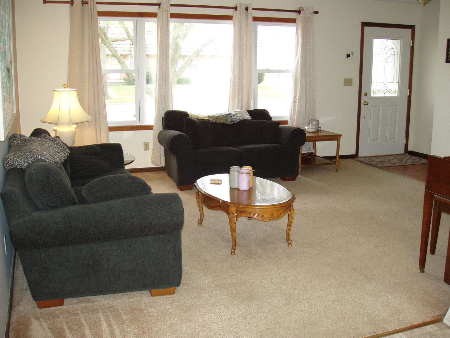 1102 Normal Road DeKalb, IL 60115 - Photo 3 of 22 a living room with furniture a table and a large window