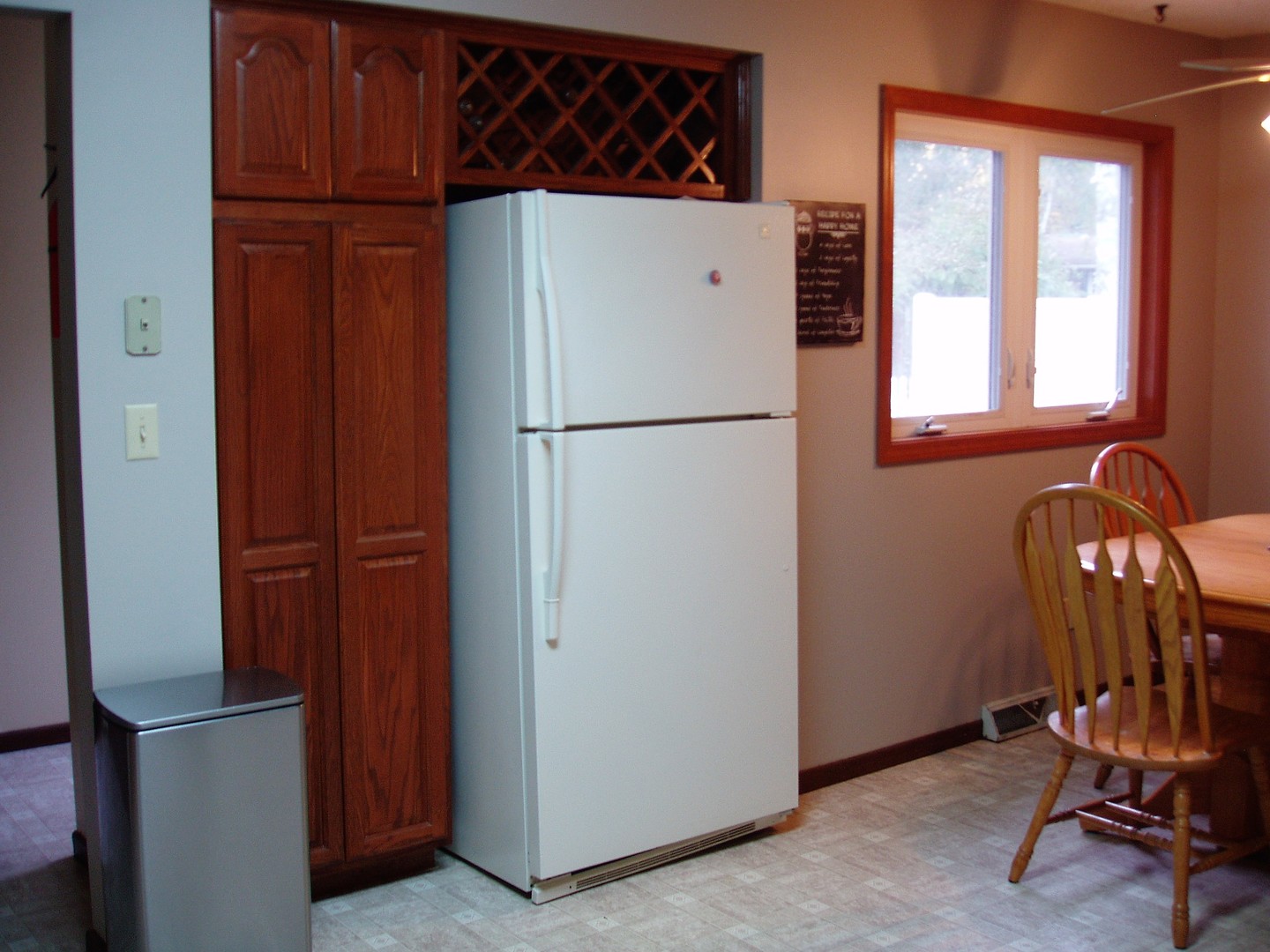 1102 Normal Road DeKalb, IL 60115 - Photo 8 of 22 a white refrigerator freezer sitting in a kitchen