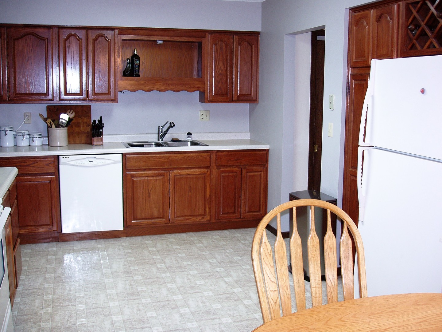 1102 Normal Road DeKalb, IL 60115 - Photo 9 of 22 a kitchen with stainless steel appliances granite countertop a refrigerator sink and cabinets