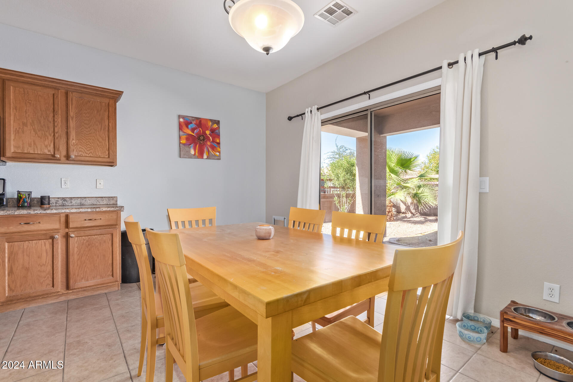 18750 East Ryan Road Queen Creek, AZ 85142 - Photo 12 of 36 a view of a dining room with furniture and window