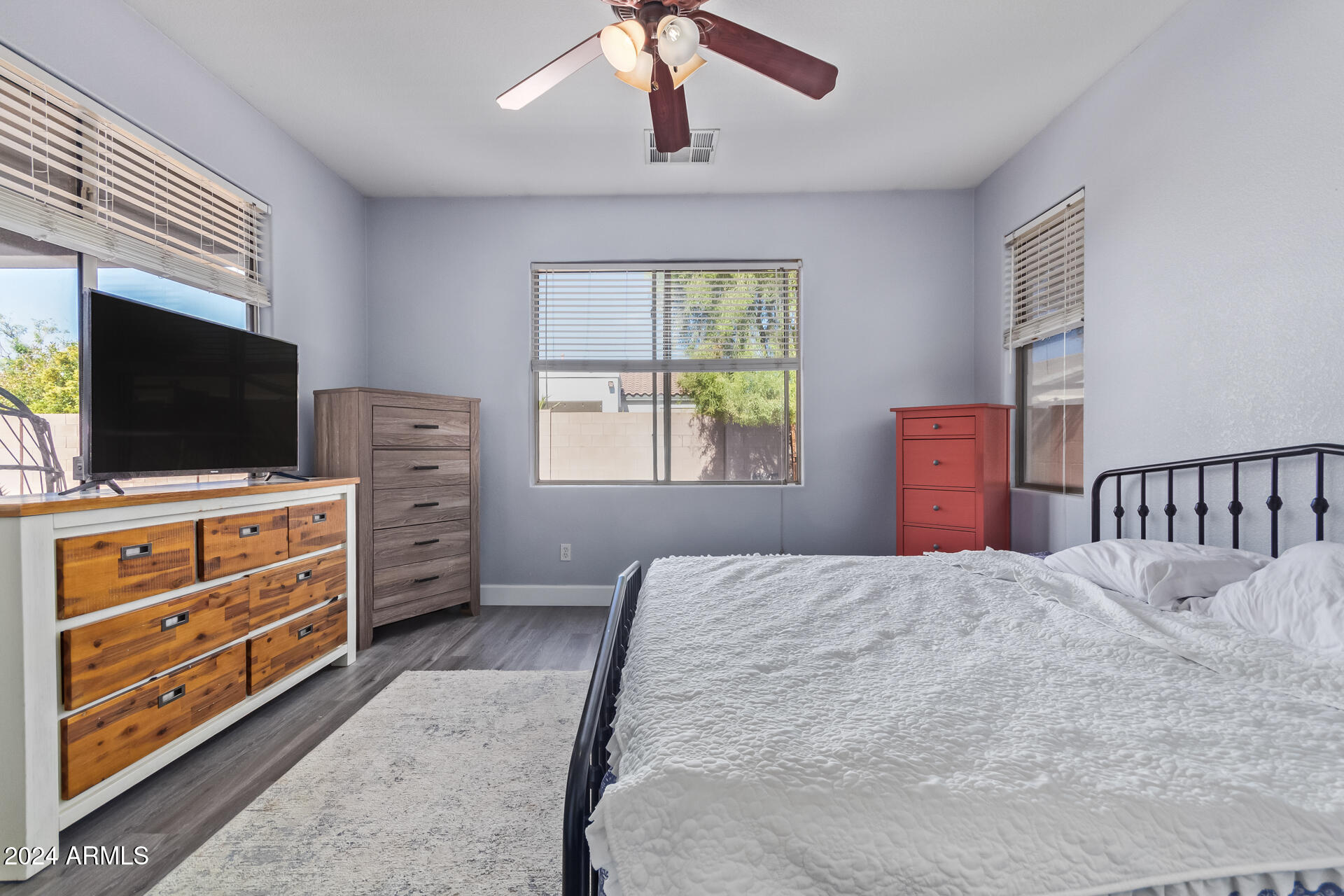 18750 East Ryan Road Queen Creek, AZ 85142 - Photo 18 of 36 a bedroom with furniture and flat screen tv