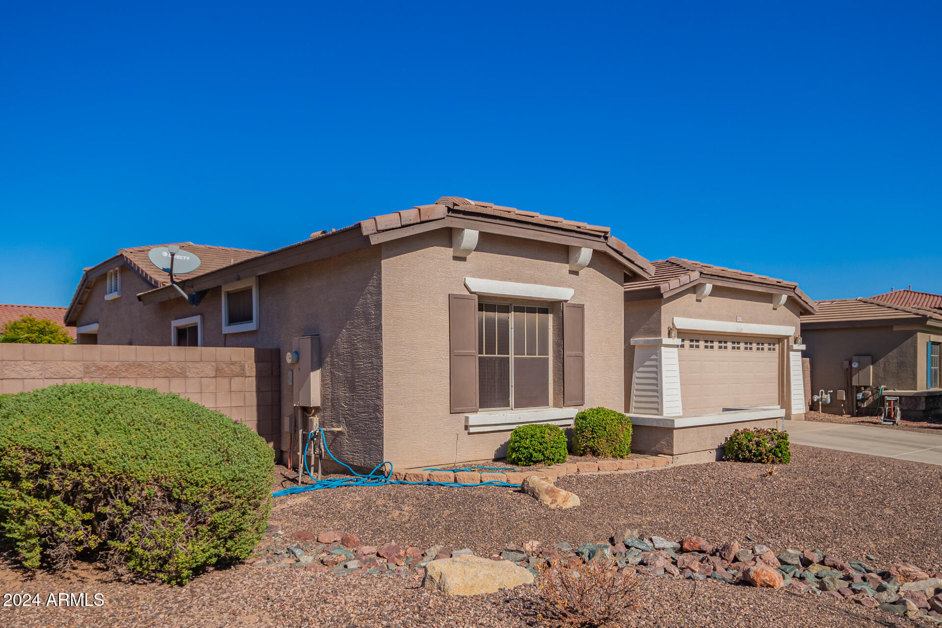 18750 East Ryan Road Queen Creek, AZ 85142 - Photo 2 of 36 a front view of a house with a yard
