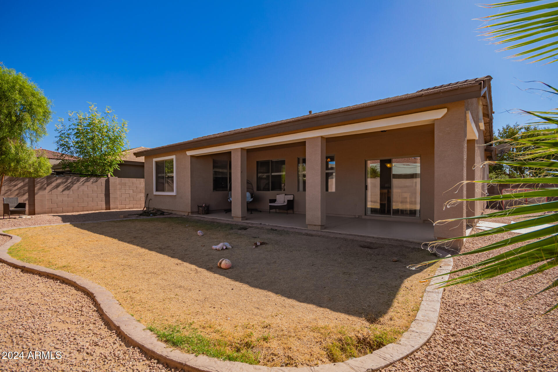 18750 East Ryan Road Queen Creek, AZ 85142 - Photo 30 of 36 a view of a house with a patio