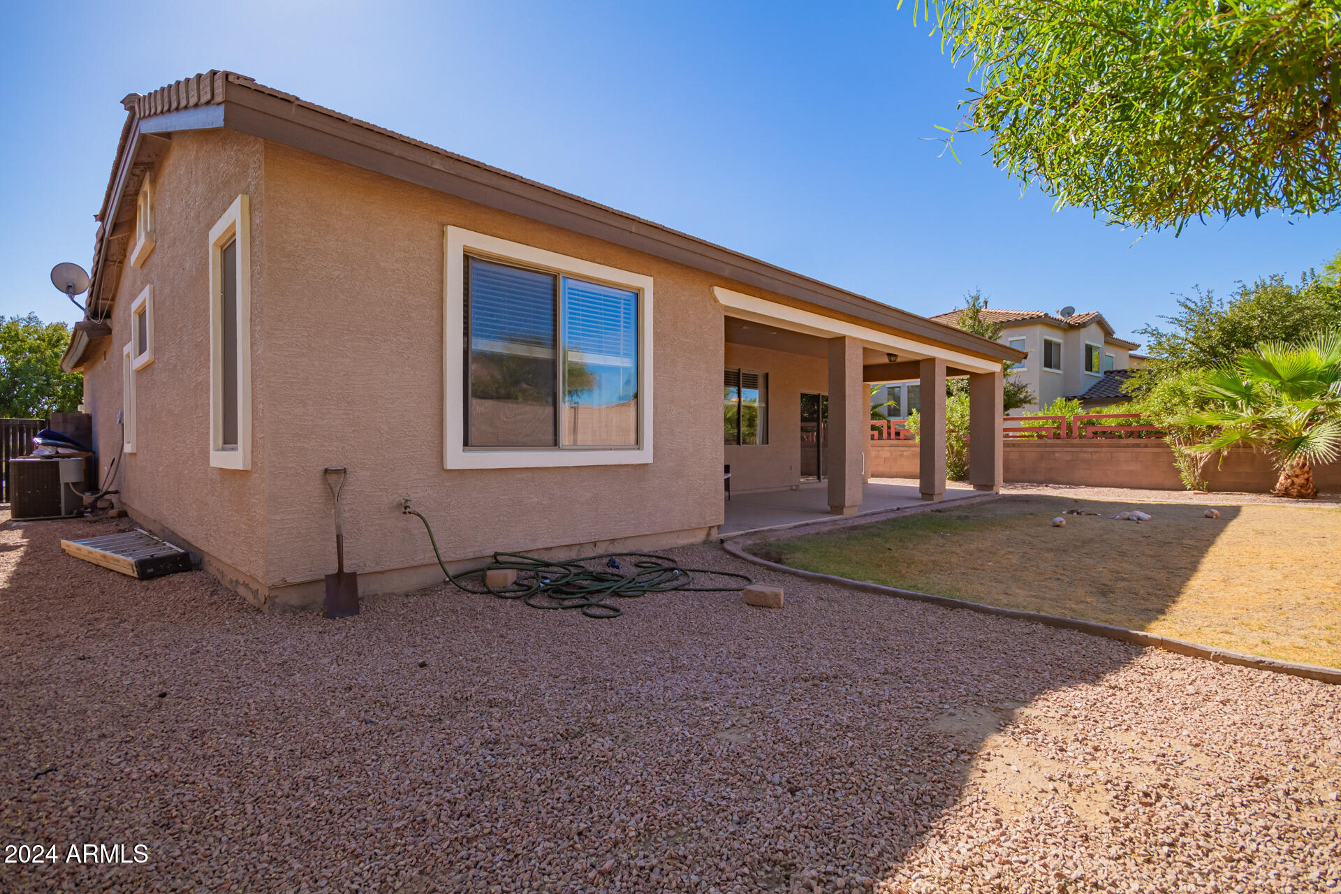 18750 East Ryan Road Queen Creek, AZ 85142 - Photo 31 of 36 a view of a house with a yard