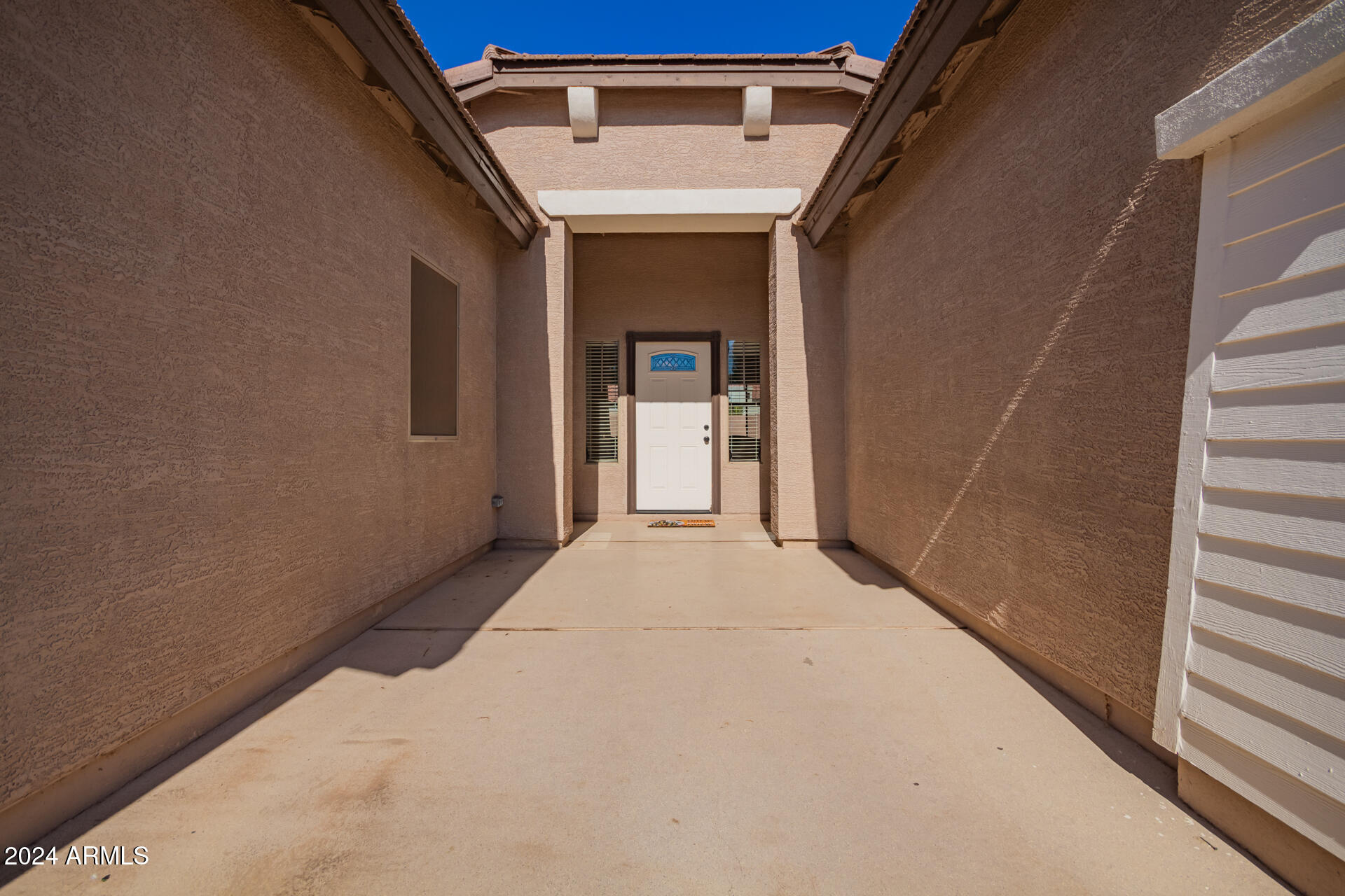 18750 East Ryan Road Queen Creek, AZ 85142 - Photo 4 of 36 a view of a house with a hallway